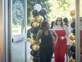 Students arrive in PE Monroe auditorium for the Student Life Awards