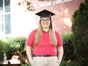 Tiffany Holman stands in front of Mauney Music Building